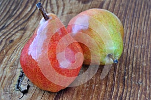 Two pears on a old wooden table