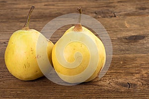 Two pears over wood