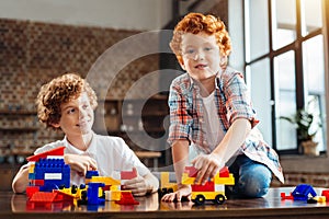 Redhead little kid playing with his older brother