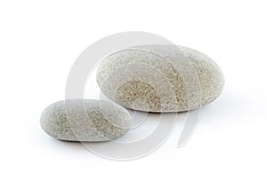 Two pebbles on white background