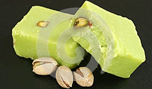 Two peices of pistachio barfi