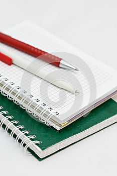 Two pens on the notepad