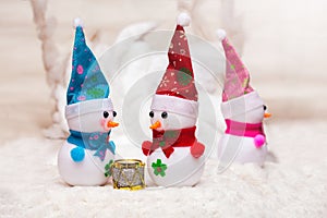 Two people are communicating and the third is insulted. Christmas and New Year snowmen_