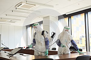 Two People Disinfecting Office photo