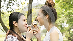 two people fat and cute girl eat ice cream with feeling delicious