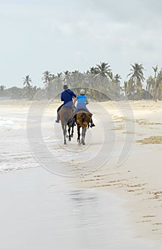 Two people go on horseback