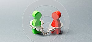 Two people are handcuffed. Unbreakable bond. Strong trusting relationships and reliable partners. Business deal concept.