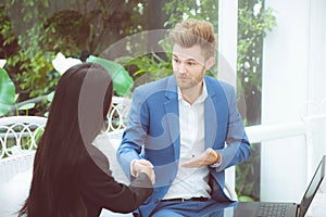 Two people happiness success business partner shaking hands in the office