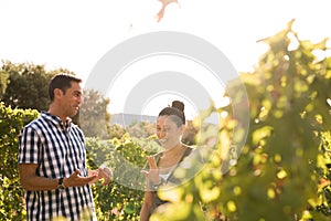 Two people having a chat in the vineyards