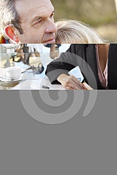 Two People Having Meeting Around Glass Table In Boardroom With C