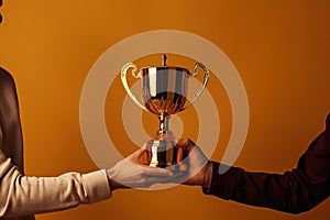 Two people holding a gold trophy. Sports, champion and hands of team