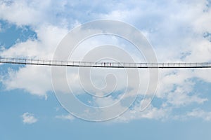 Two People Isolated in the Middle of High Long Suspension Bridge