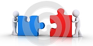 Two people join the puzzle pieces