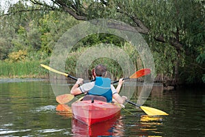 Two people in kayaks on the river