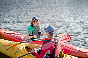 Two people in kayaks on the river