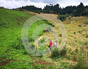 Two people on Mangapohue Natural Bridge walk in Waitomo in summer