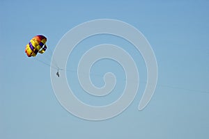 Two people parasailing