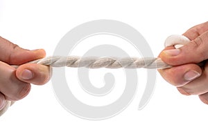 Two people pulling a rope in opposite direction isolated on white background