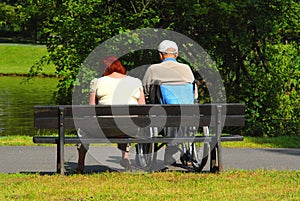 Two people relaxing in park