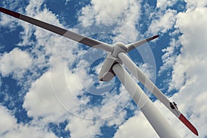 Two people repairing wind turbine