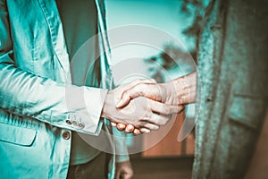 Two People Shaking Hands in a Room