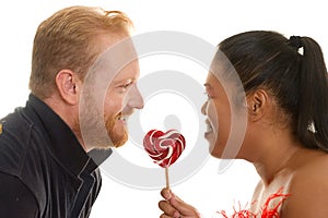 Two people share a candy