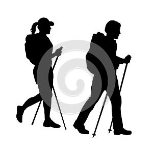 Two people silhouettes while hiking in nature