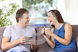 Two people talking and laughing at home
