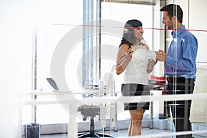 Two people talking in an office