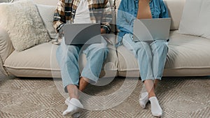 Two people unrecognizable cropped African American family internet dependent couple busy man woman overuse computers