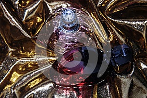 Two perfumes over gold