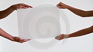 Two person hands holding blank empty sign white board for promotional content. Copy space advertising area mock up