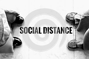 Two person stay away each other keeping Social distance.