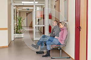 Two persons in a waiting room