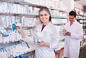 Two pharmacists in modern pharmacy