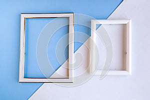 Two photo frames on geometric blue and white background