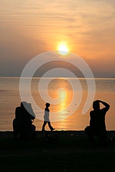 Two photographers and a walker