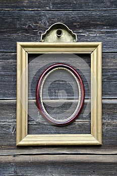 Two picture frame on old wooden wall