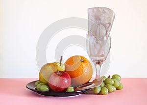 Two piece ostomy appliance including flange and pouch surrounded by fruit