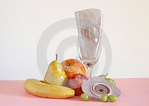 Two piece ostomy appliance including flange and pouch surrounded by various fruit