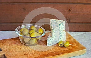 Two pieces of blue cheese and olives