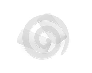 Two pieces of chewing gum on white background, top view