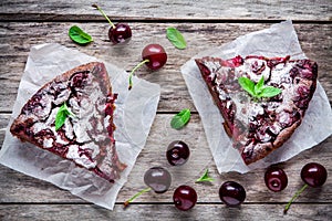 Two pieces of chocolate cake Clafoutis with cherries