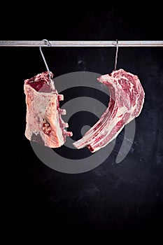 Two pieces of cote de boeuf on rack photo