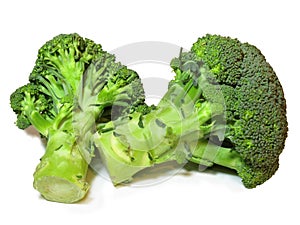 Two pieces of fresh Broccoli isolated on a white background