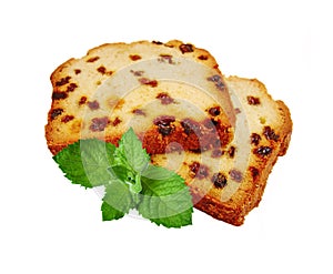 Two pieces of fruitcake and green mint photo