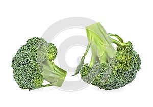 Two pieces of green broccoli isolated on white background