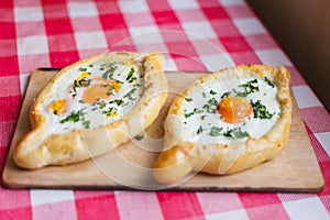 Two pieces of hachapuri on a table