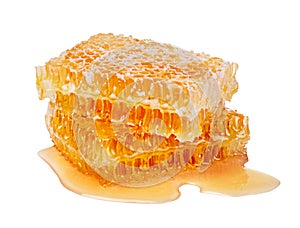 Two pieces of honeycomb on white background