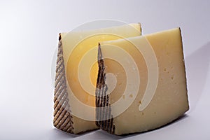 Two pieces of Manchego, queso manchego, cheese made in La Mancha photo